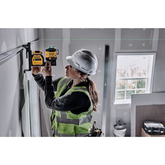 Woman using Dewalt Green Laser